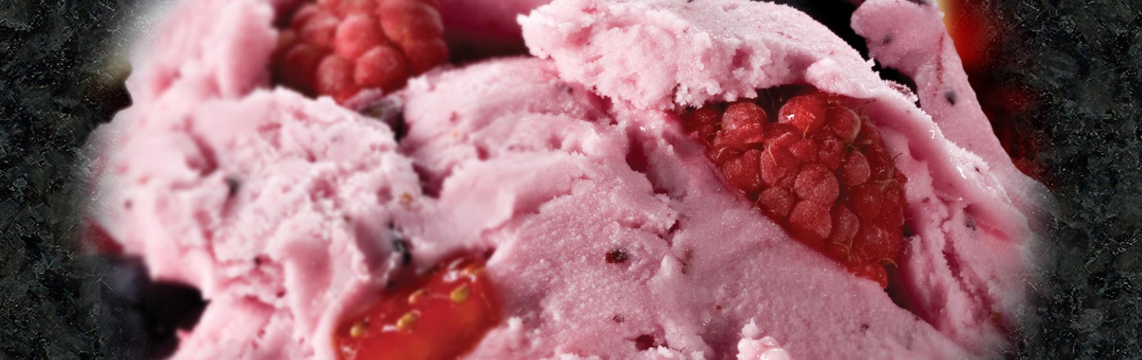Close-up photo of frozen Raspberry Yogurt with fresh raspberries